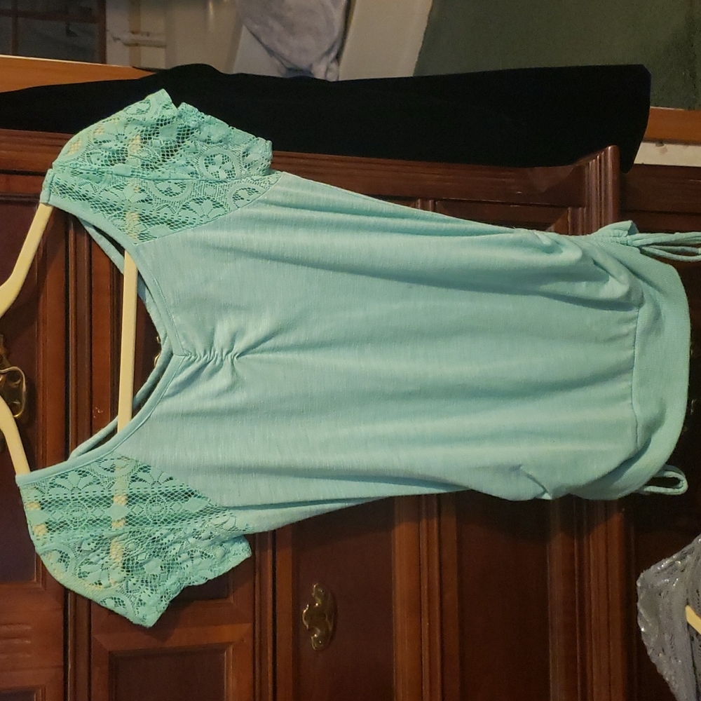 Blue top with lace sleeves, ties at waist